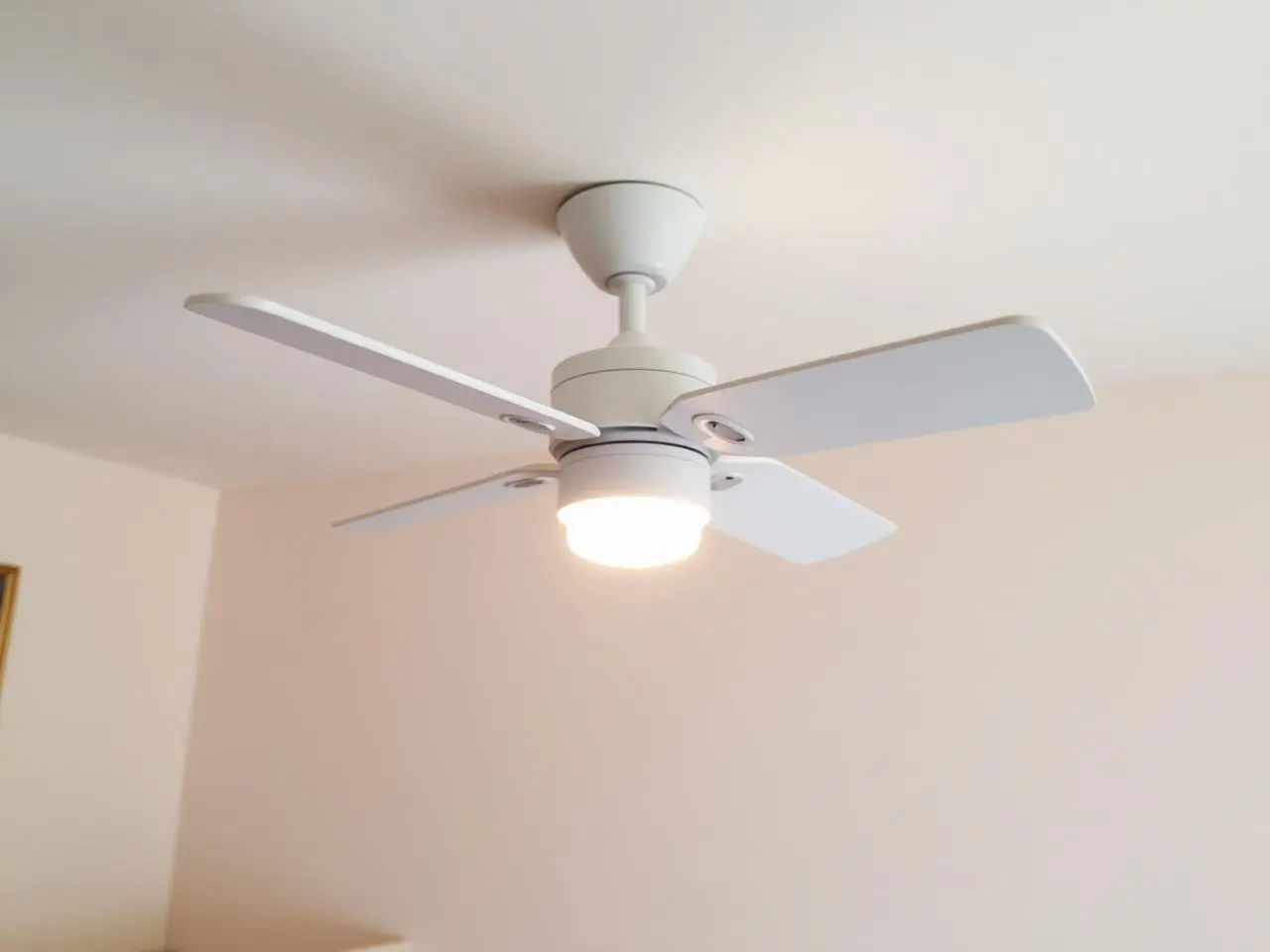Ceiling fan installation in Lake Worth nursery with small white fan and soft dimmable night light over crib